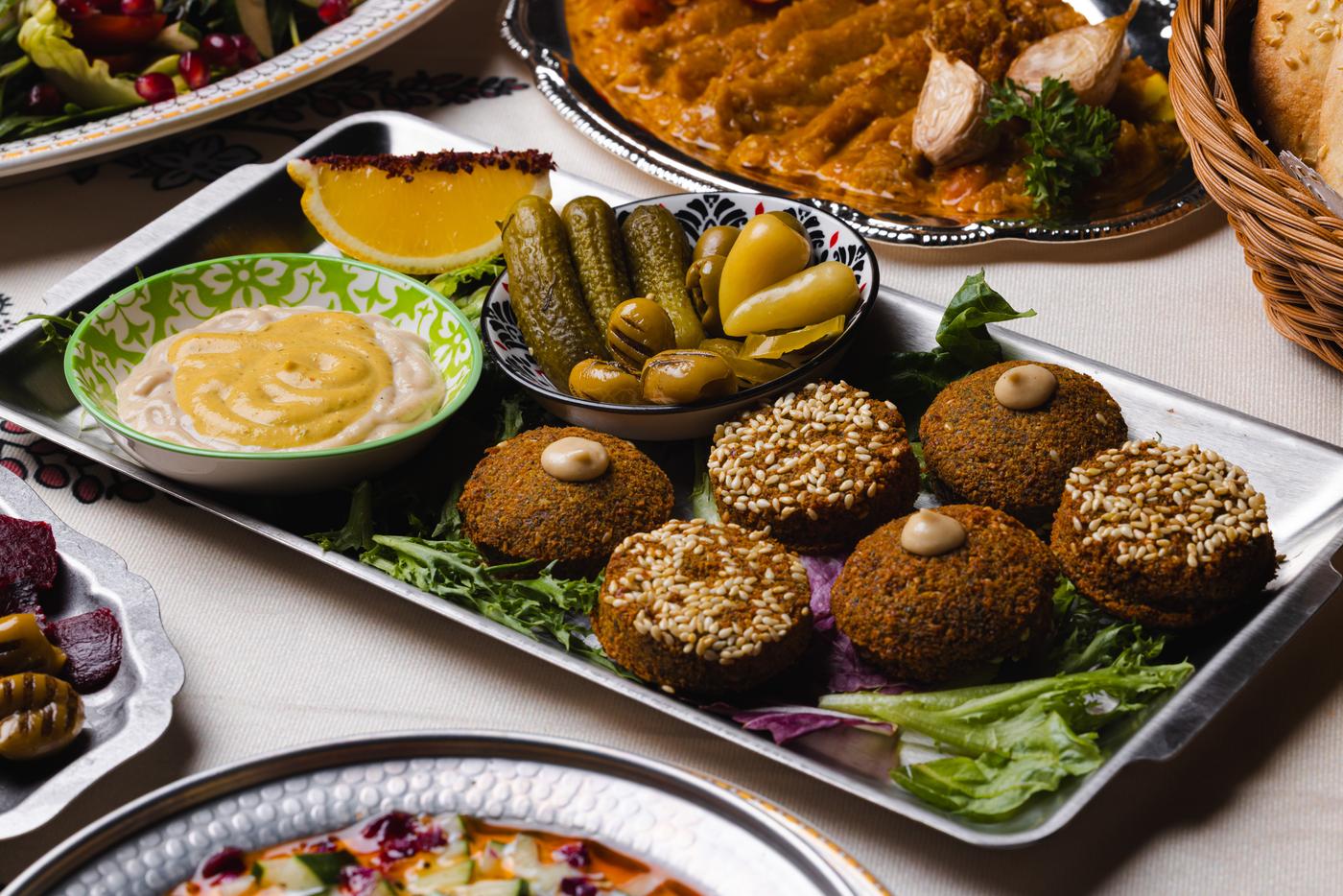 The falafel platter: sesame-crusted falafel, hummus, pickles and fresh herbs