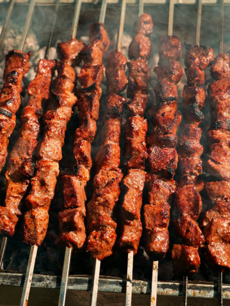 Kababs grilling over charcoal