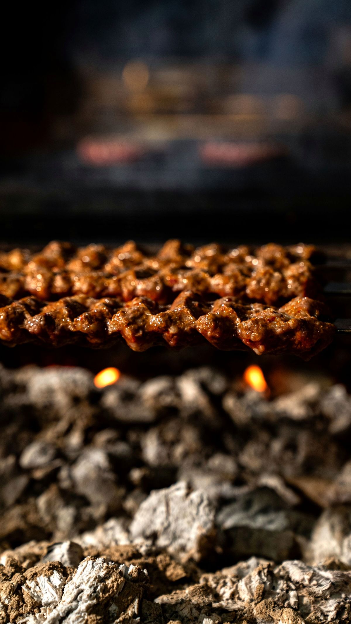 Skewers over open charcoal